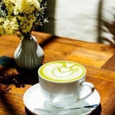 Green tea matcha latte in white cup